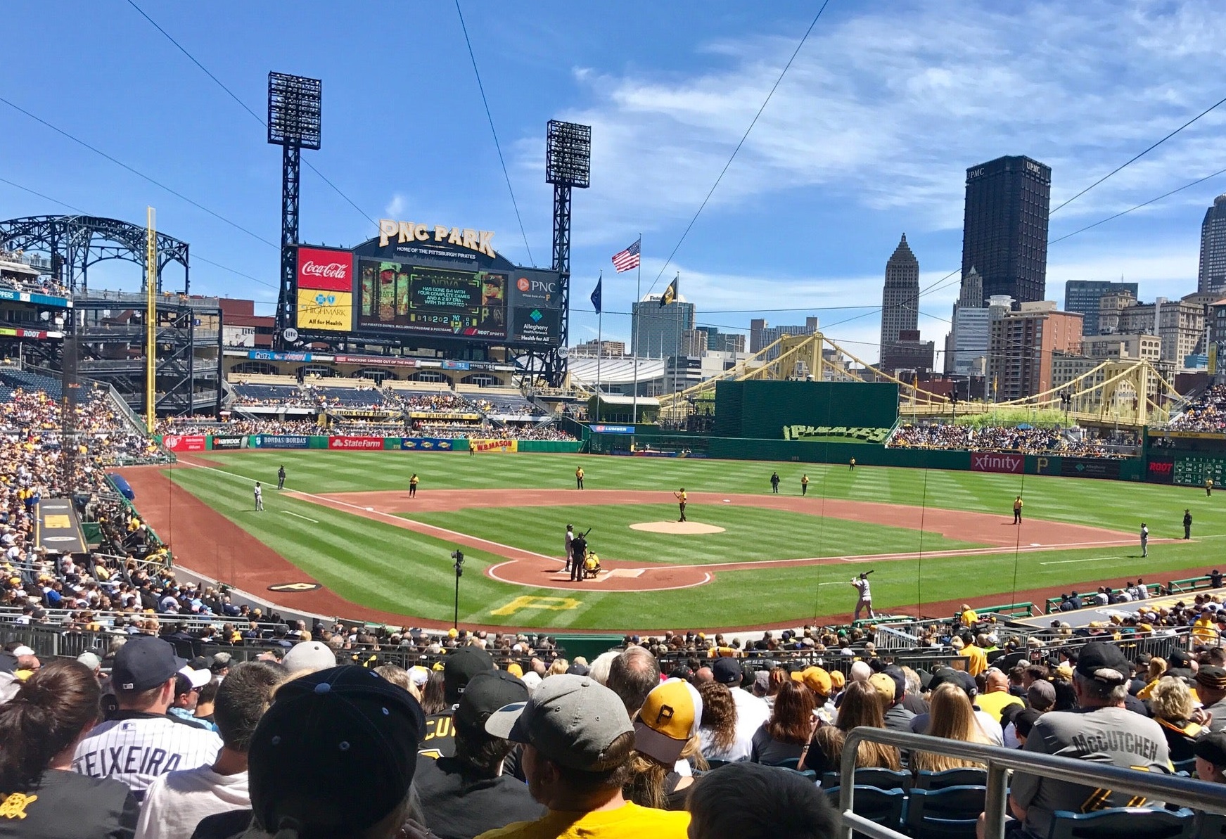 A Pittsburgh Pirates sits in the empty seats of PNC Park and watches an  exhibition game against the Cleveland Indians on Saturday, July 18, 2020 at PNC  Park in Pittsburgh. Photo by