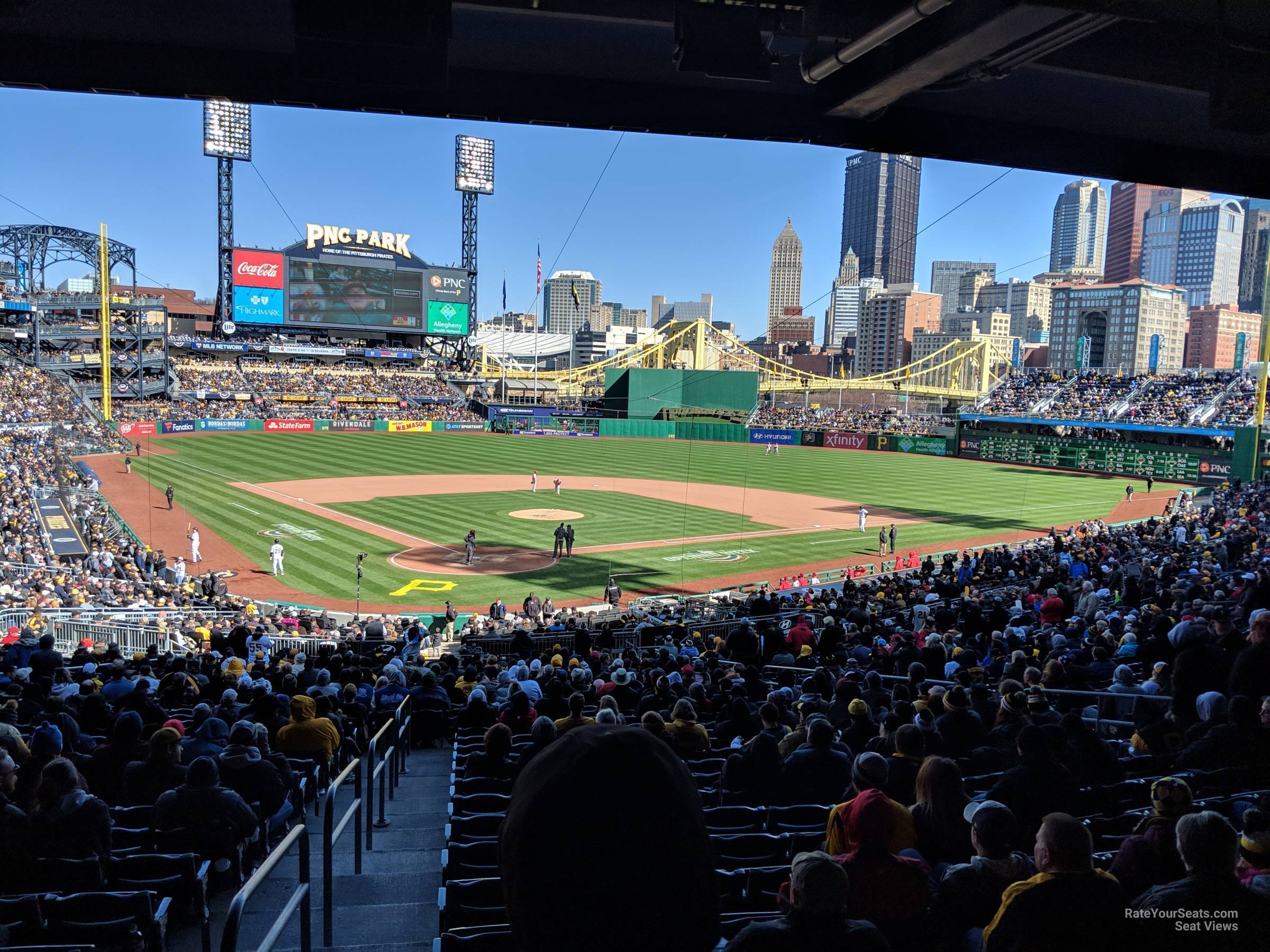A Pittsburgh Pirates sits in the empty seats of PNC Park and watches an  exhibition game against the Cleveland Indians on Saturday, July 18, 2020 at PNC  Park in Pittsburgh. Photo by