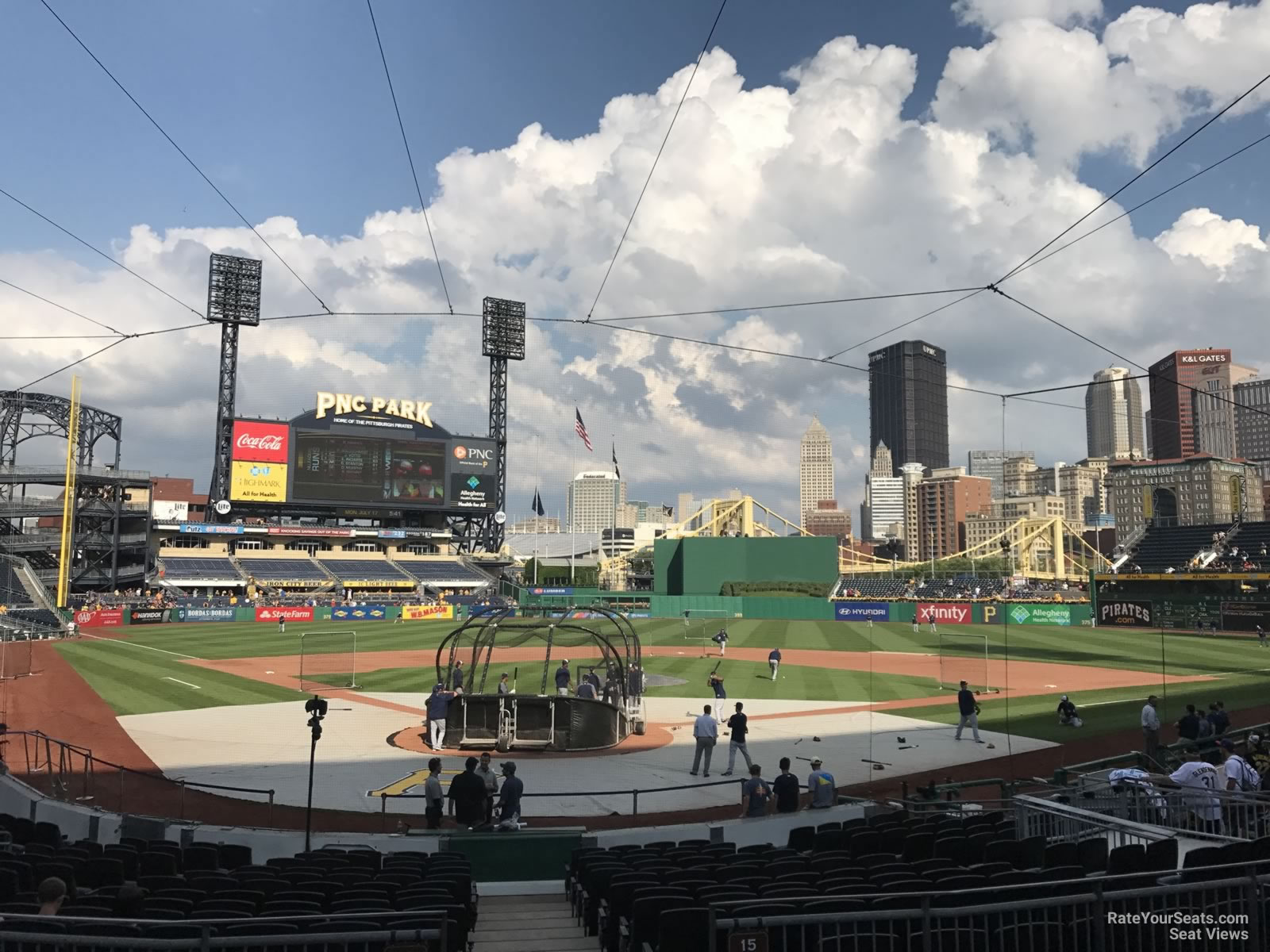 A Pittsburgh Pirates sits in the empty seats of PNC Park and watches an  exhibition game against the Cleveland Indians on Saturday, July 18, 2020 at PNC  Park in Pittsburgh. Photo by