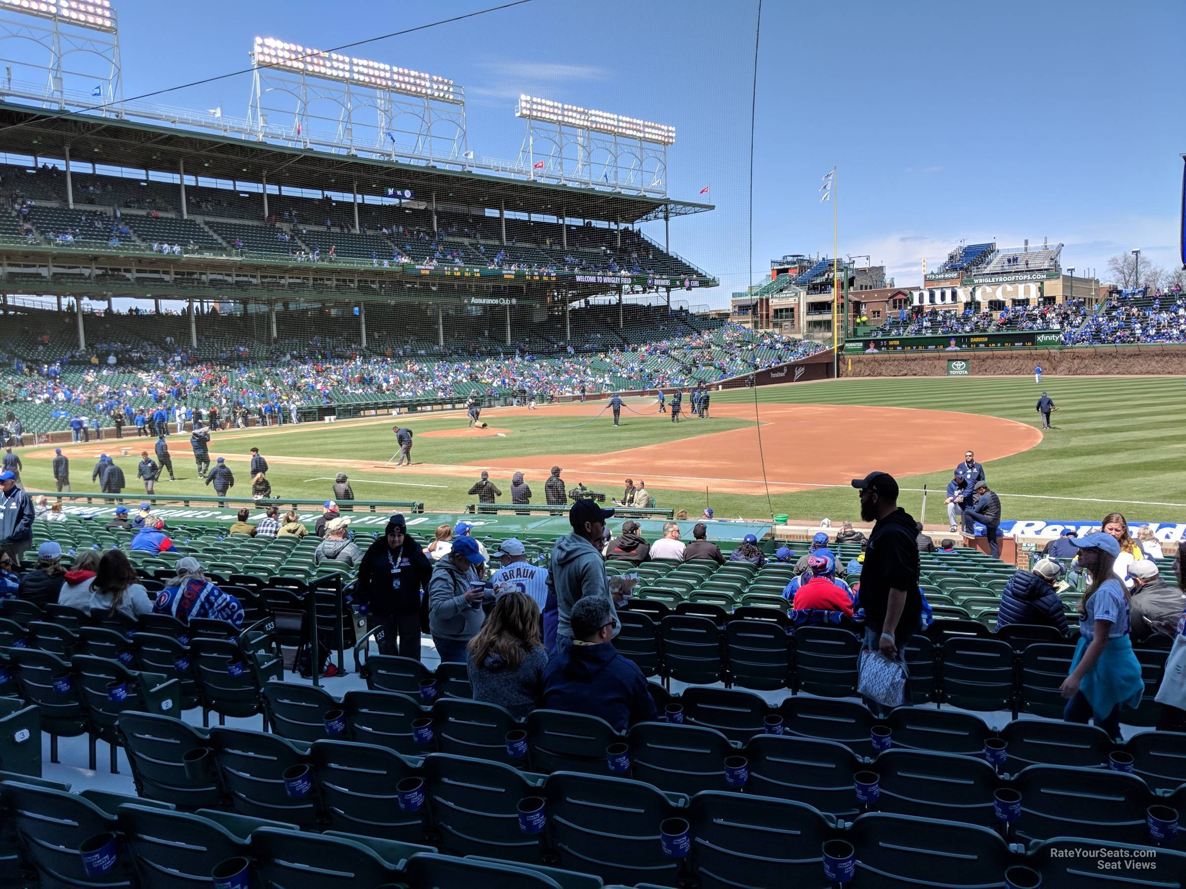 Mesa 12, The Cubs Park scoreboard features a clock on top, …