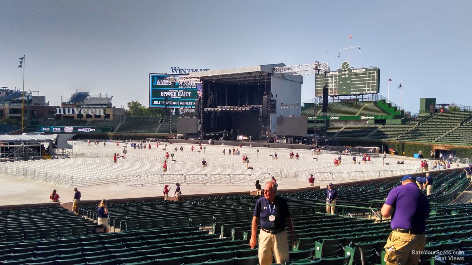 Mesa 12, The Cubs Park scoreboard features a clock on top, …